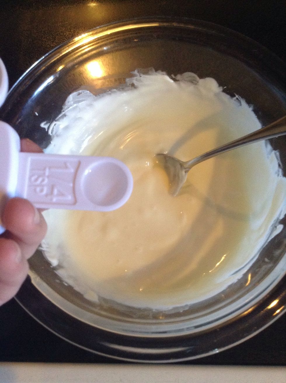 Pour 1/4 teaspoon peppermint extract into chocolate and stir again.