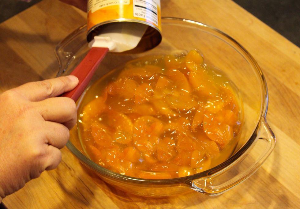 Pour 1 can of peach pie filling into the bottom of an oven-safe casserole dish and spread evenly. For best results, use a 9x12 dish.