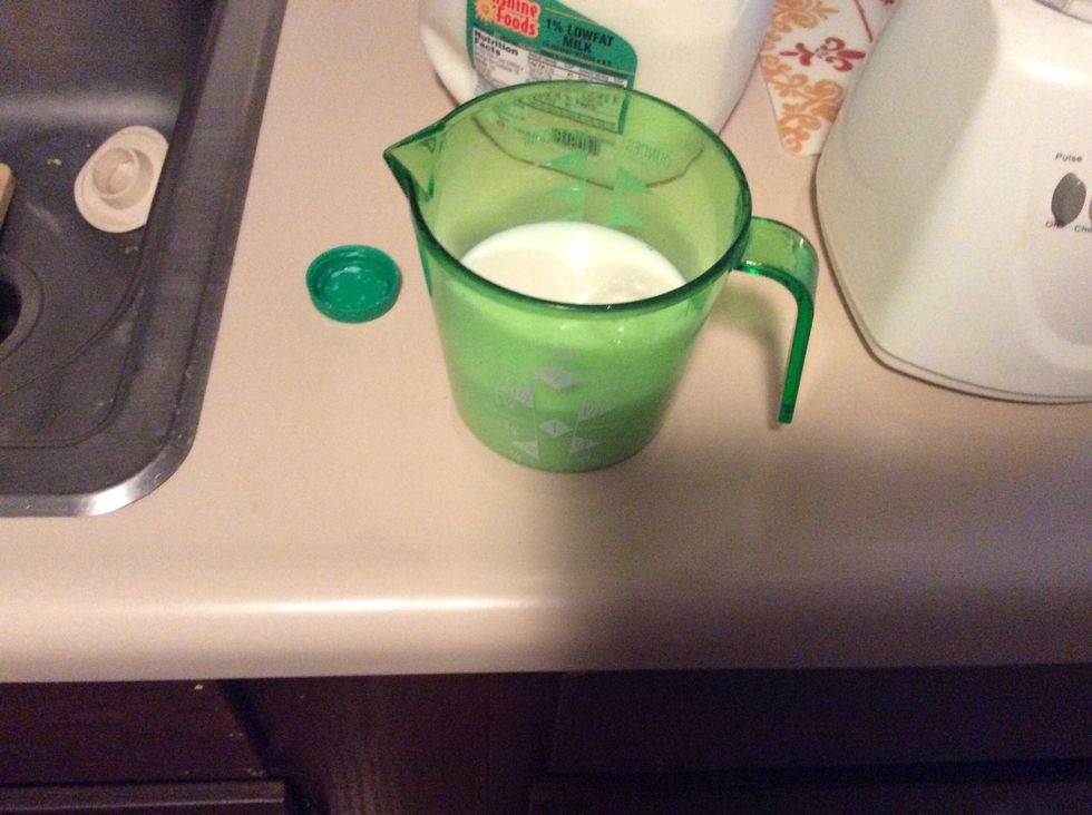 Pour 1 cup milk into measuring cup