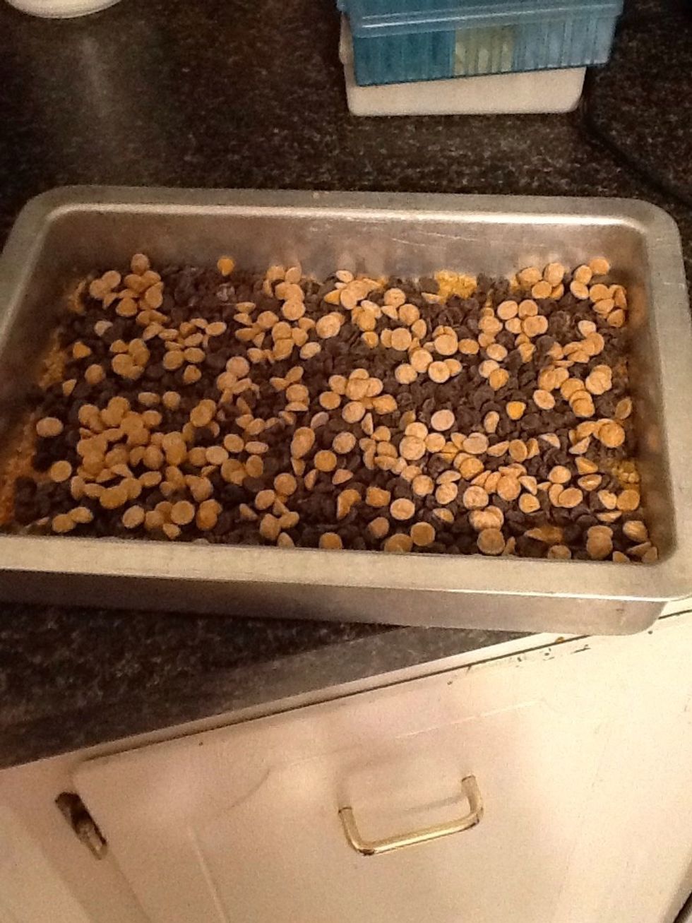 Pour 1 cup of butterscotch chips in the pan till spread flat.