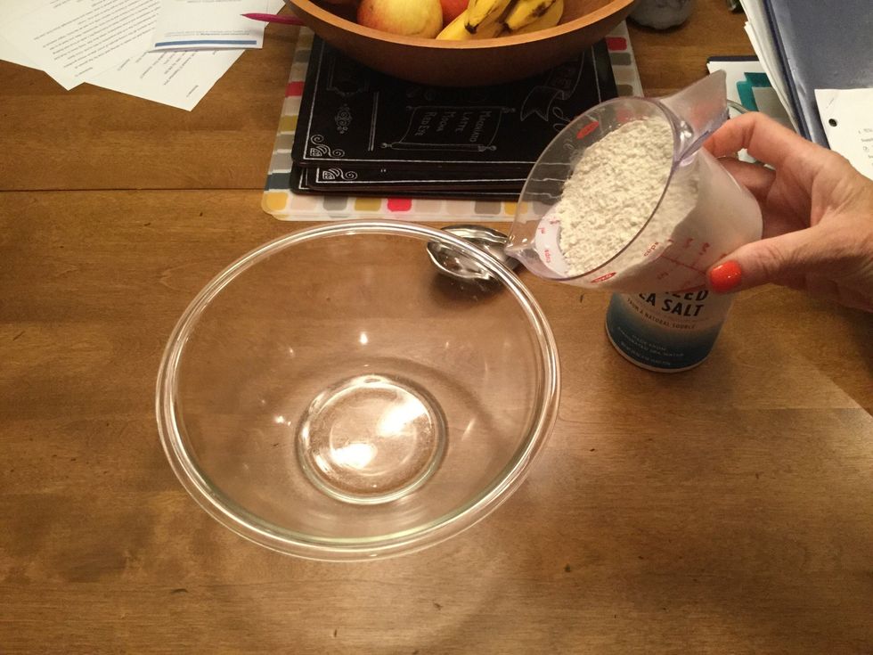 Pour 1 cup of flour into a large glass bowl.