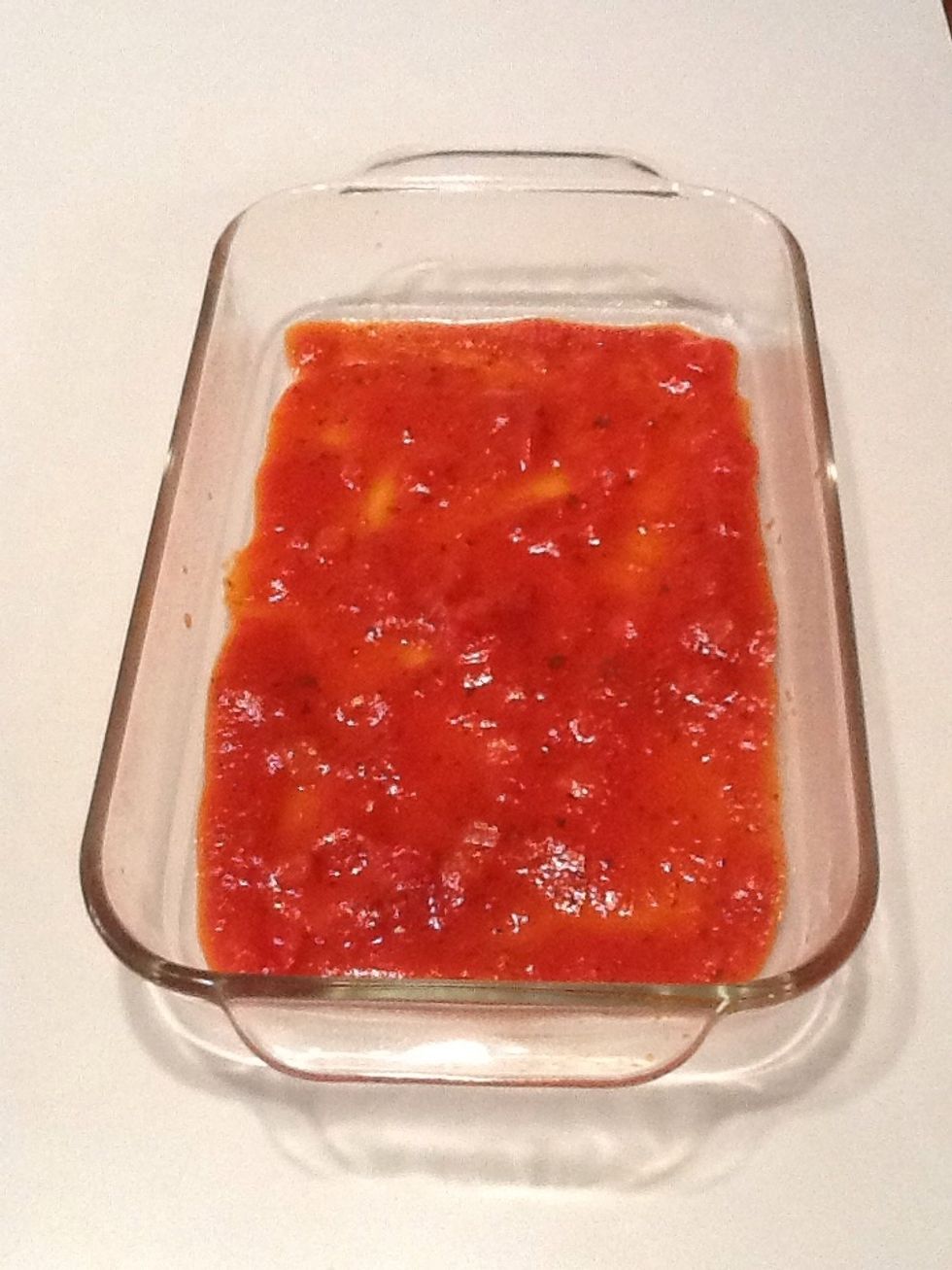 Pour 1 cup of sauce into pan and spread along the bottom.