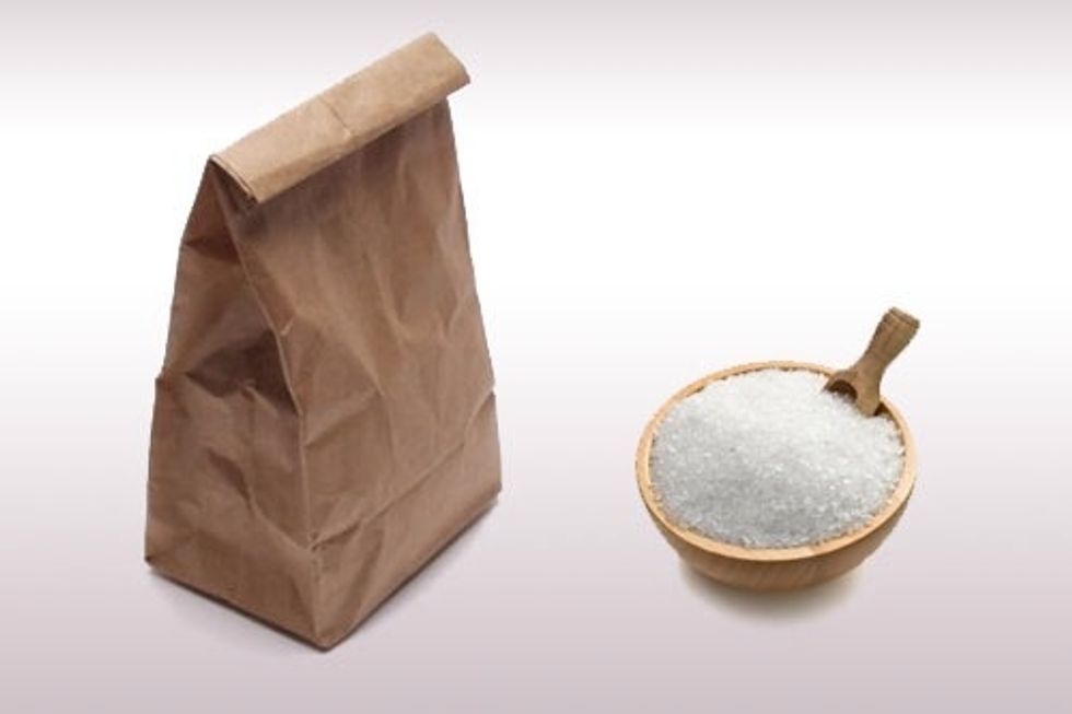 Pour 1 cup of table salt into a paper bag, then put your flower heads into the bag.
