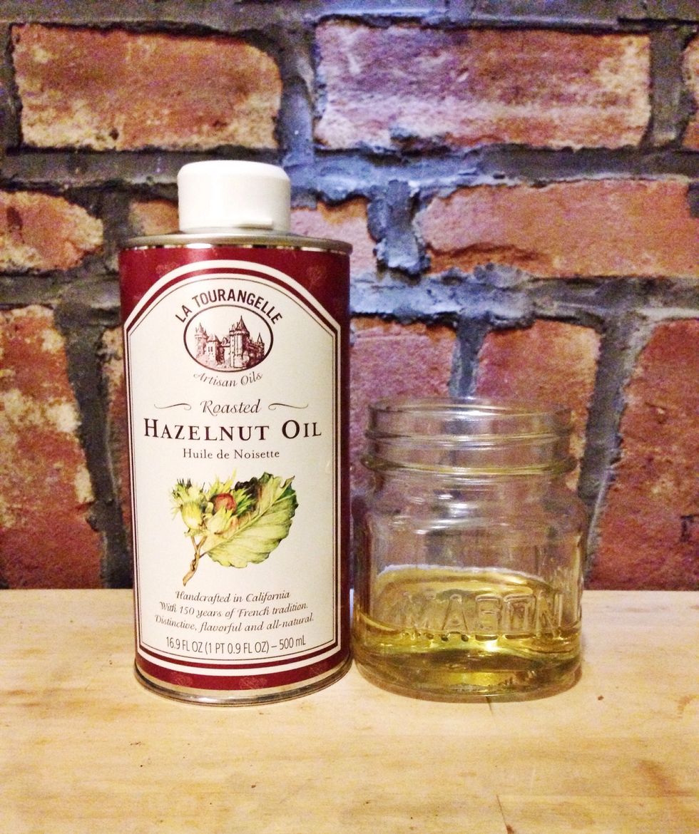 Pour 1 part hazelnut oil into a clean glass jar. Hazelnut Oil acts as a natural astringent and is good for oily skin.