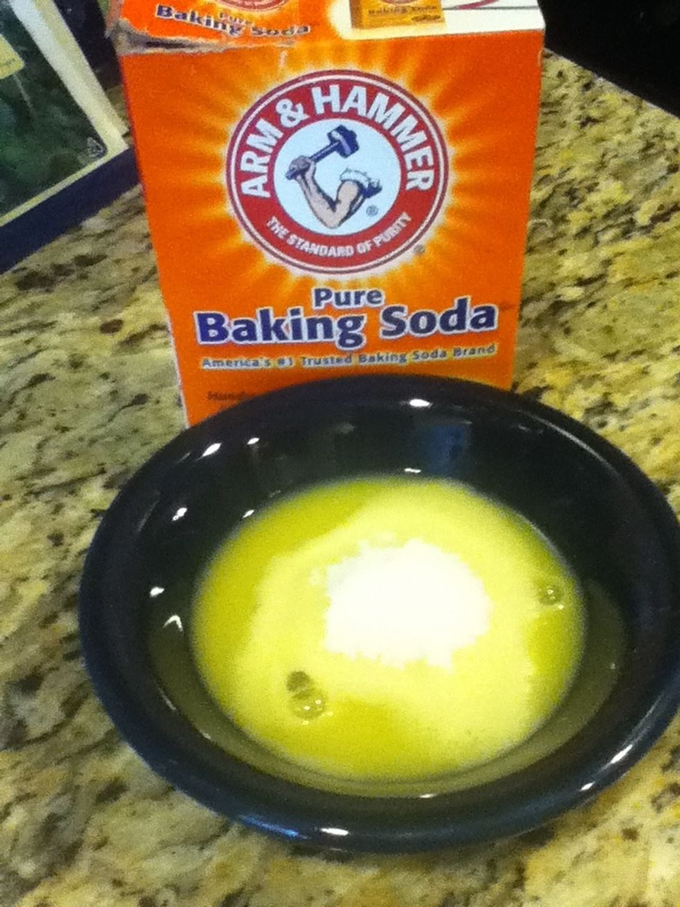 Pour 1 tablespoon of baking soda into the bowl.