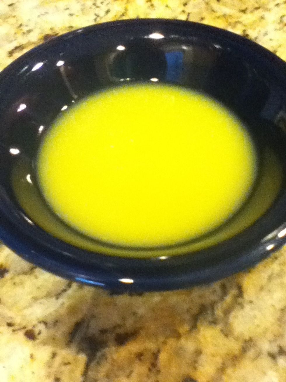 Pour 1 tablespoon of orange juice into a bowl.