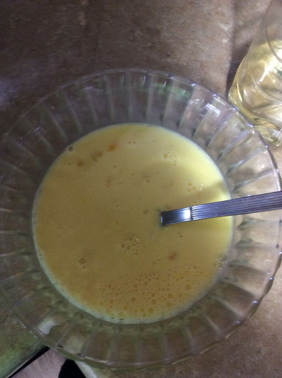 Pour 2 cups of milk into the bowl with the eggs and mix together