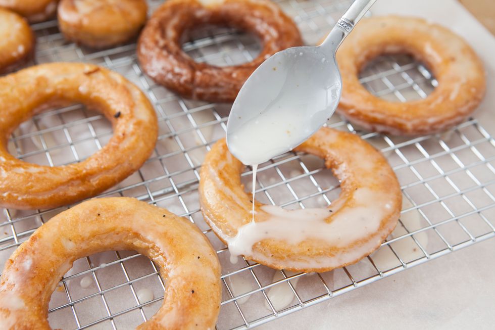 Pour 2 inches of canola oil into a heavy bottom pot. Heat to 325 F. Fry your doughnuts a few at a time for about 2 minutes inch side. Be careful not to let them burn! Let cool on a wire rack.