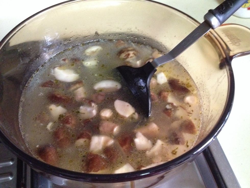 Pour 3 cups of water into the pot. Add a chicken stock.