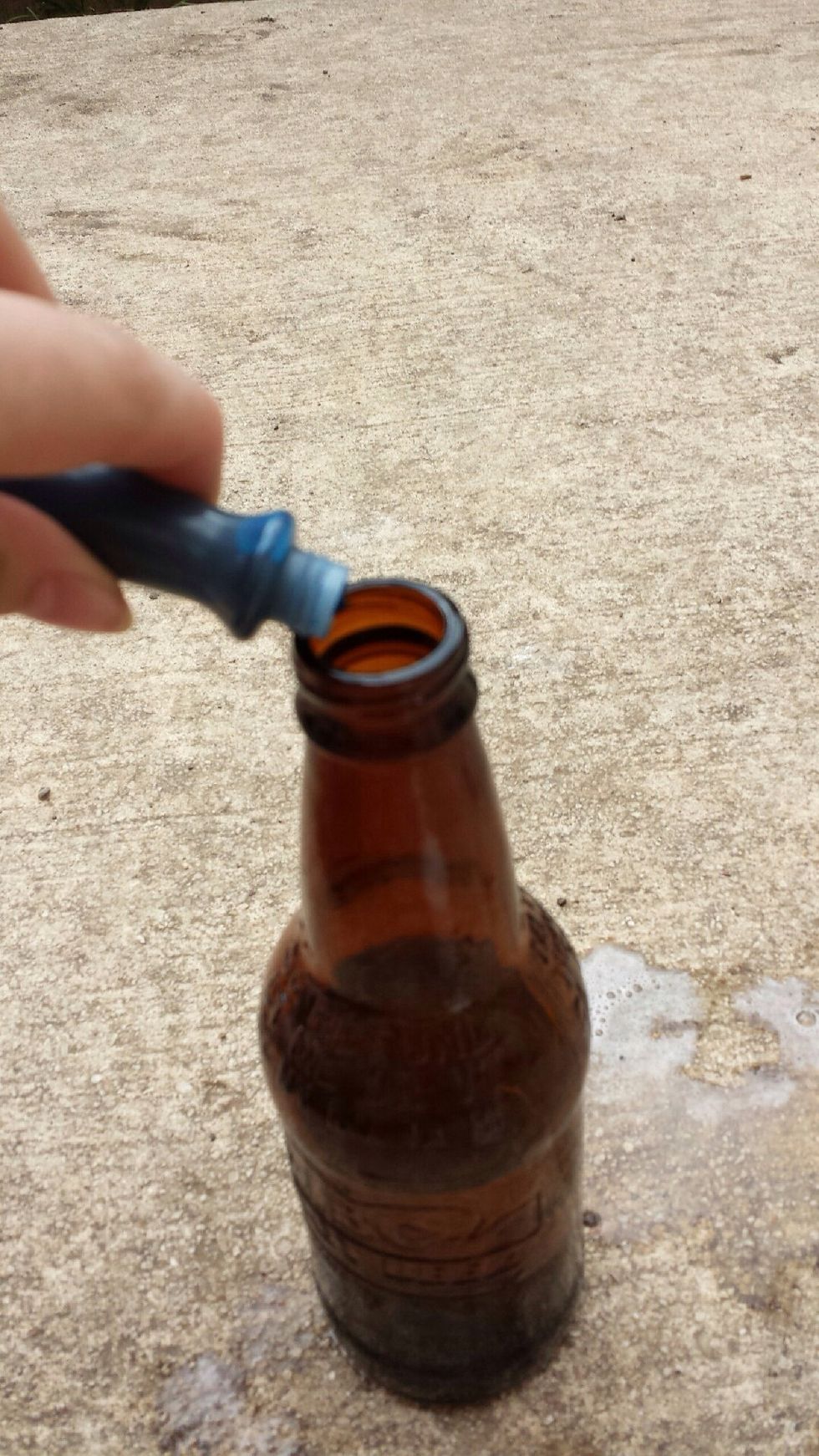 Pour 3 drops of food coloring inside bottle with hydrogen peroxide