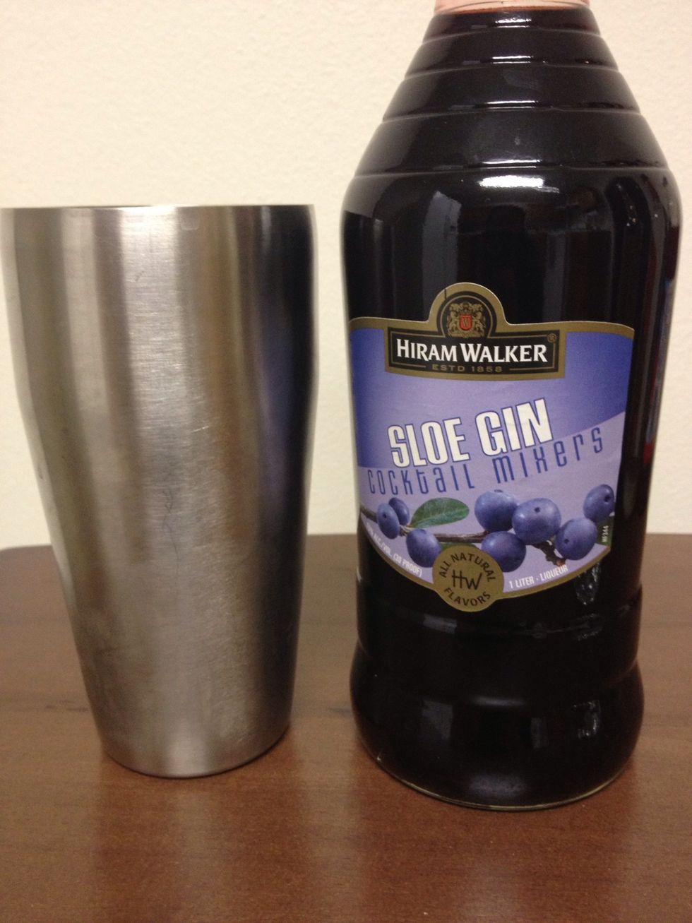 Pour a 1/2 ounce of Sloe Gin into the Shaker.