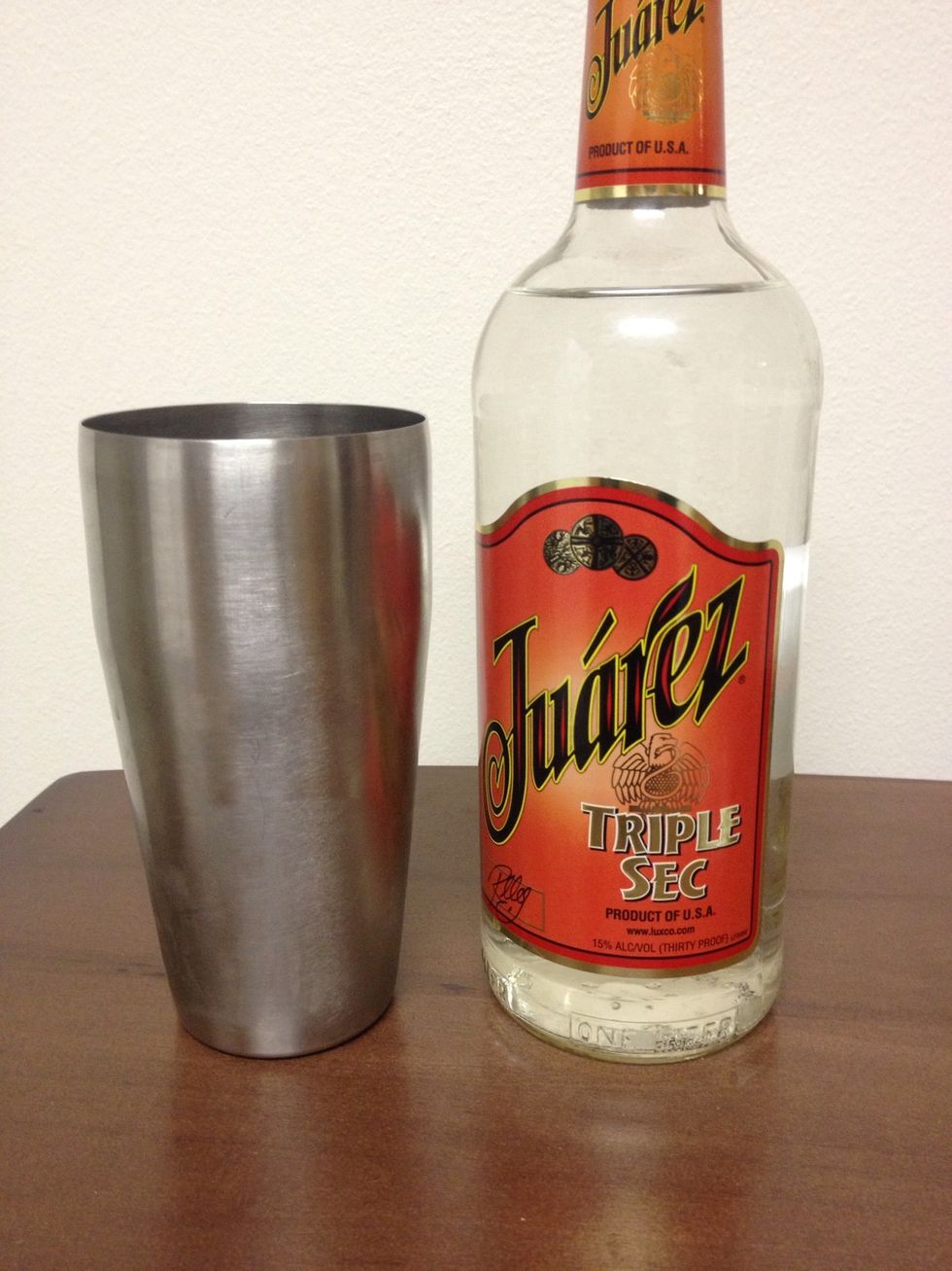 Pour a 1/2 ounce of Triple Sec into the Shaker.
