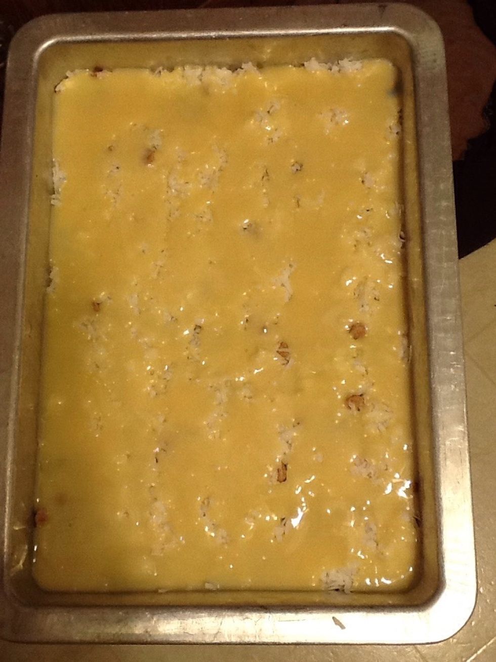 Pour a can of sweetened condensed milk and spread out.