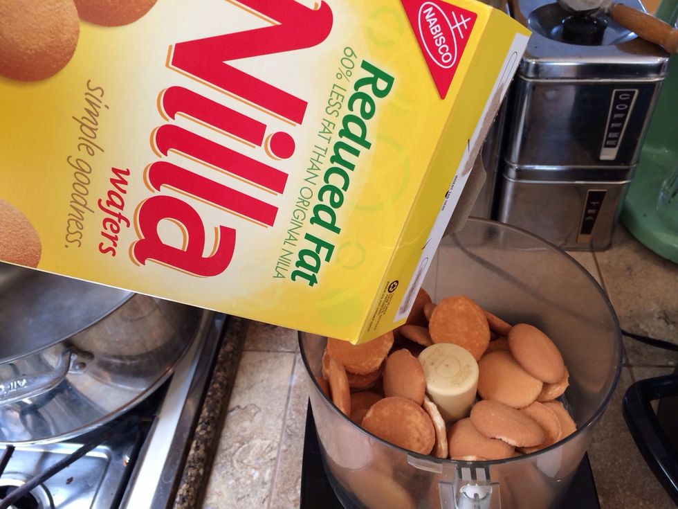 Pour a few Nilla Wafers or graham crackers in the food processor or blender.