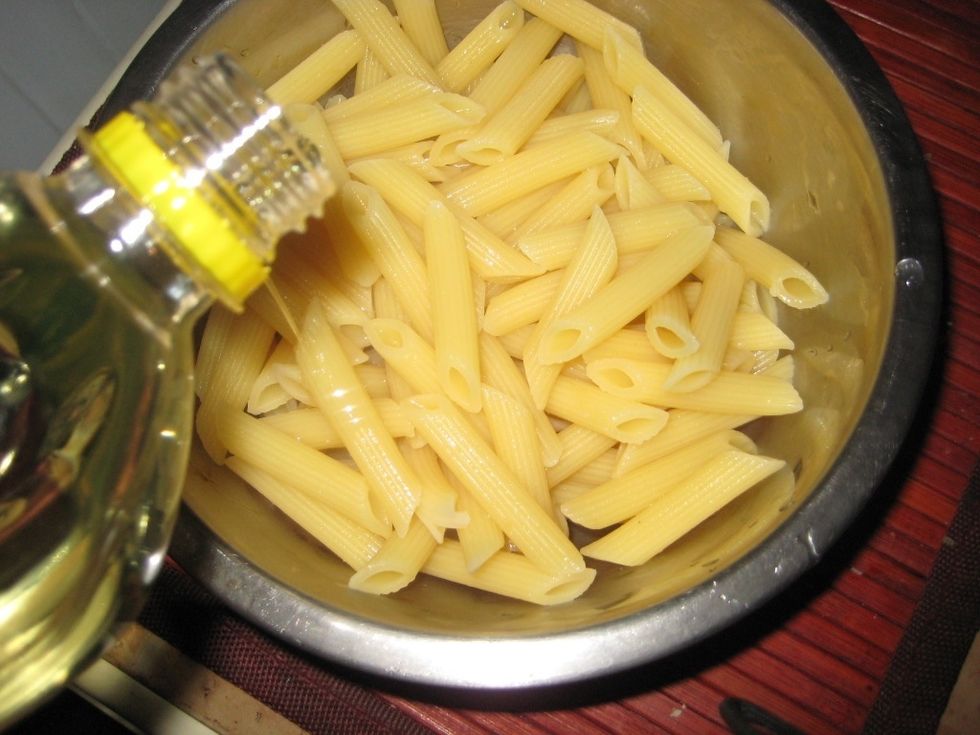 Pour a little oil. It helps to avoid the pasta from sticking to each other when not in use.