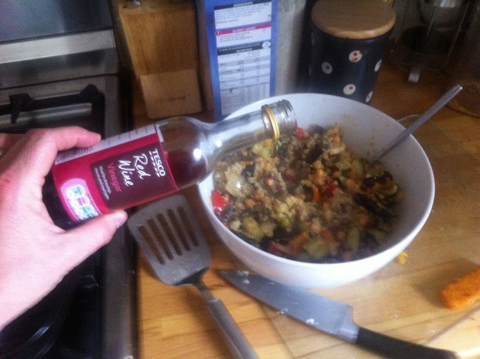 Pour a splash of red wine vinegar into the couscous. This is the key ingredient. Taste it, you might want more or less depending in your taste.