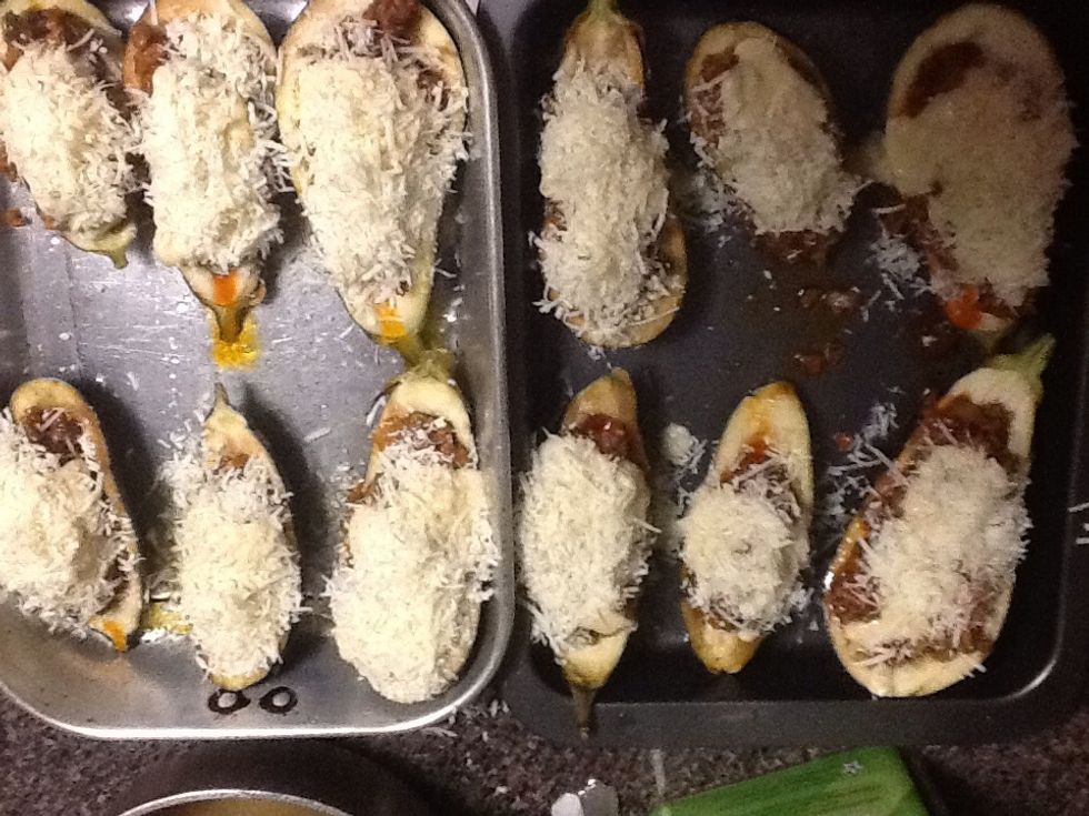 Pour a table spoon of b\u00e9chamel over the meat bowls and sprinkle with plenty of Romano cheese.