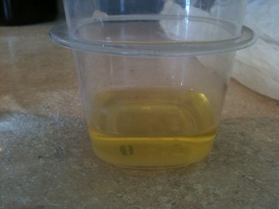 pour about 1/4 cup of EVOO into microwave safe dish. I've heard coconut oil can also be used but it's not as easy to find. It smells better, but olive oil scent does not linger after washing hair.