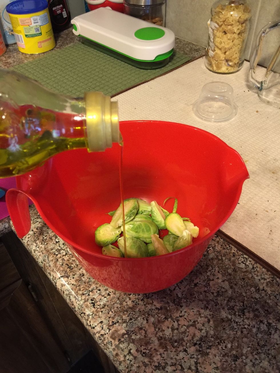 Pour about 1 tsp of olive oil in the bowl with the cut brussels sprouts.