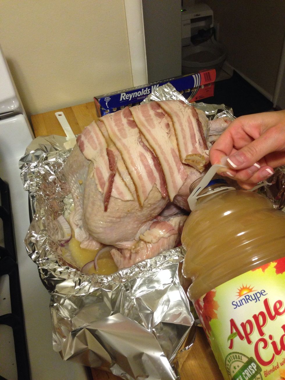 Pour apple cider into the pan with the turkey. Put at least an inch of apple cider in with the turkey. I believe this was around 2 cups for this turkey since it was rather large.