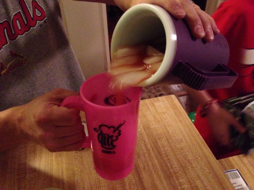 Pour back and forth between the two cups. Our glasses are super classy tonight as you can see : )