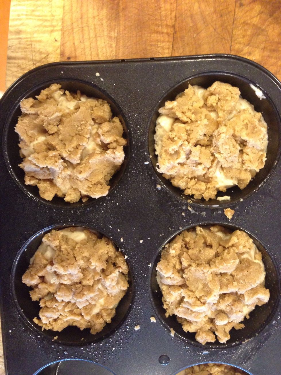 Pour batter into a greased muffin tin, and sprinkle heavily with crumble topping!