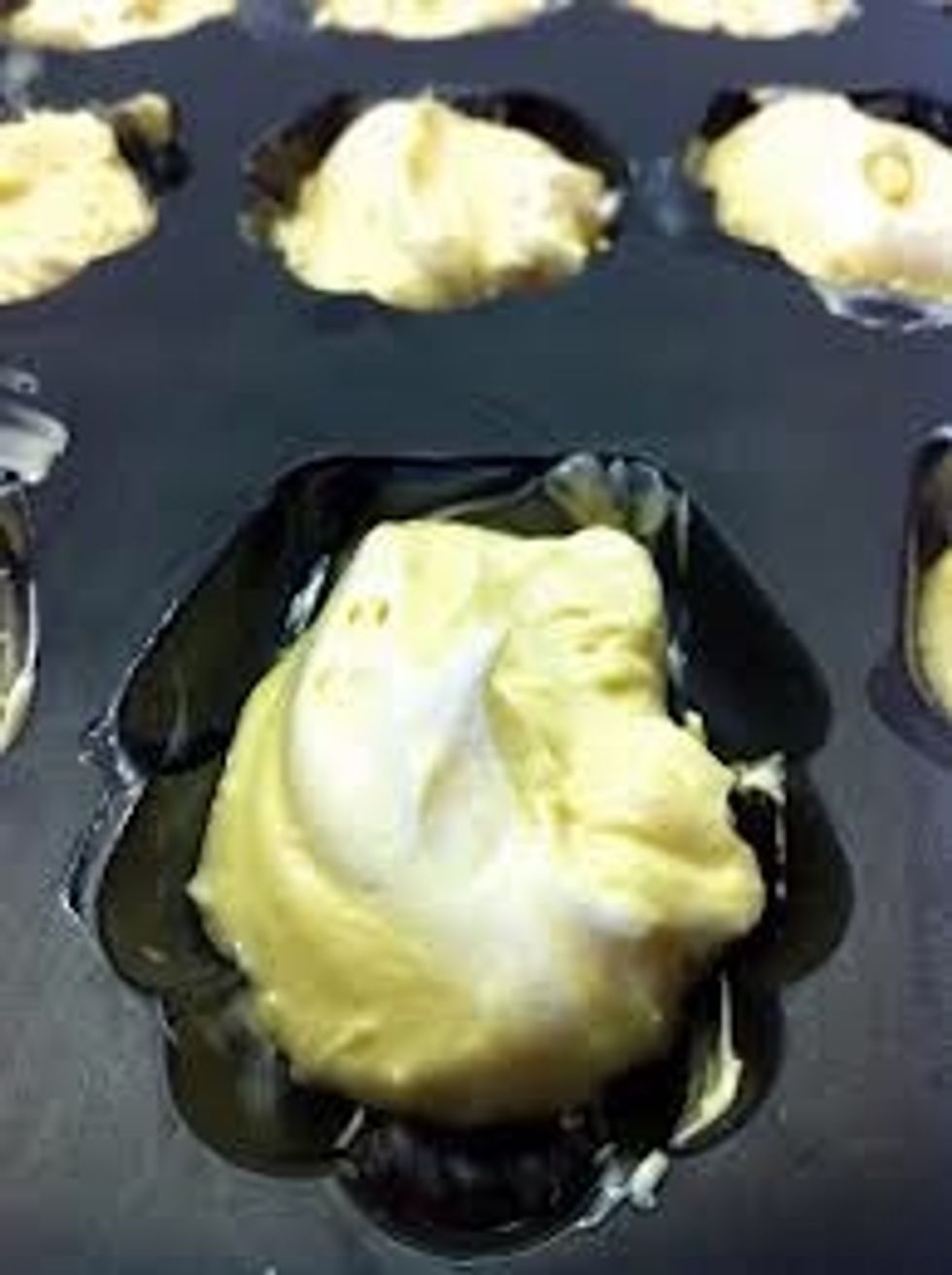 Pour batter into "madeleine biscuit" pan in small qtt.