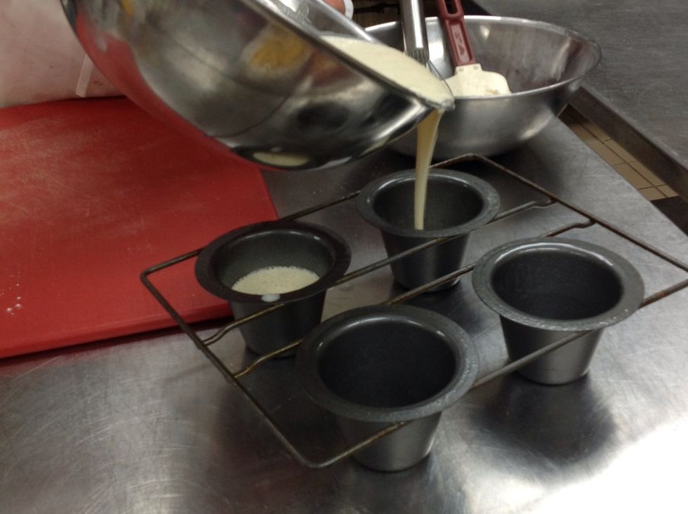 Pour batter into muffin cups.