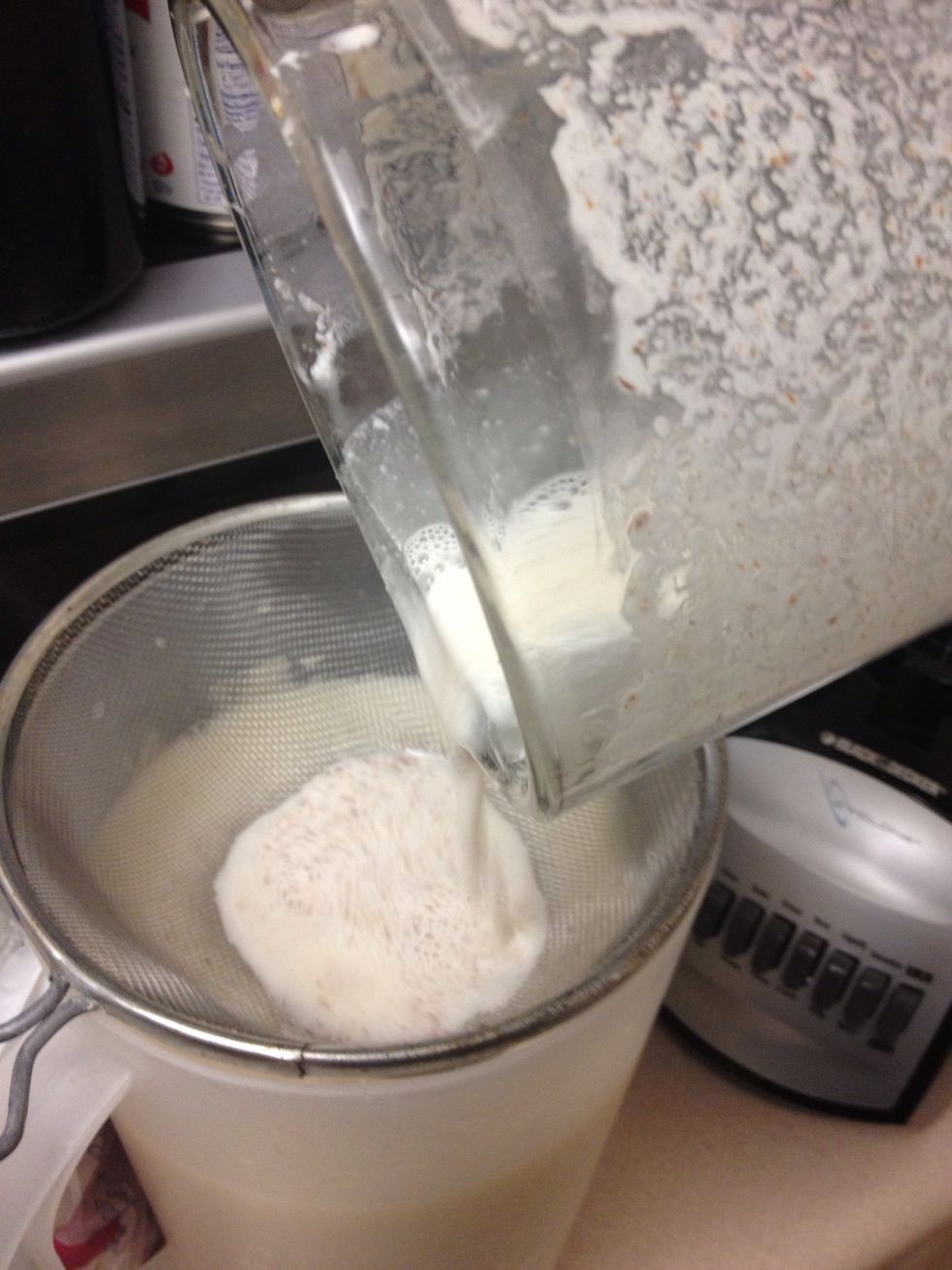 Pour blended rice mix over colander.