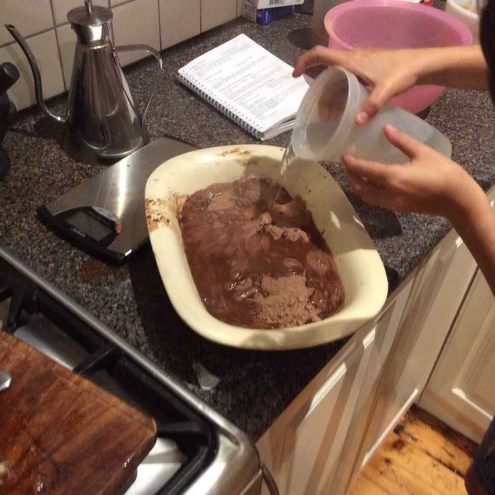 Pour boiling water over a back of a spoon on the pudding