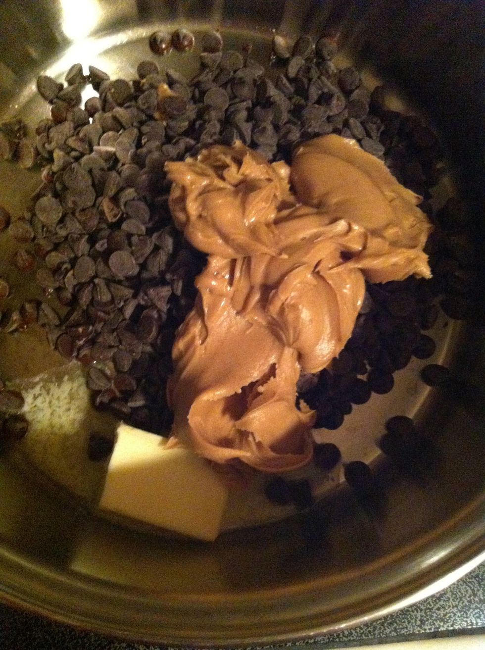 Pour butter, peanut butter and chocolate chips into a big cookie pan over medium heat