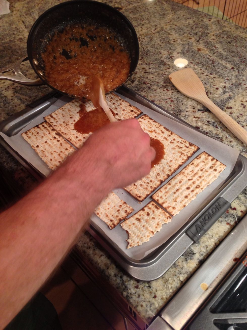 Pour caramelized butter and sugar mixture over the matzah pieces. It doesn't need to be perfect and its okay if some gets in between the pieces. Don't be so hard on yourself!