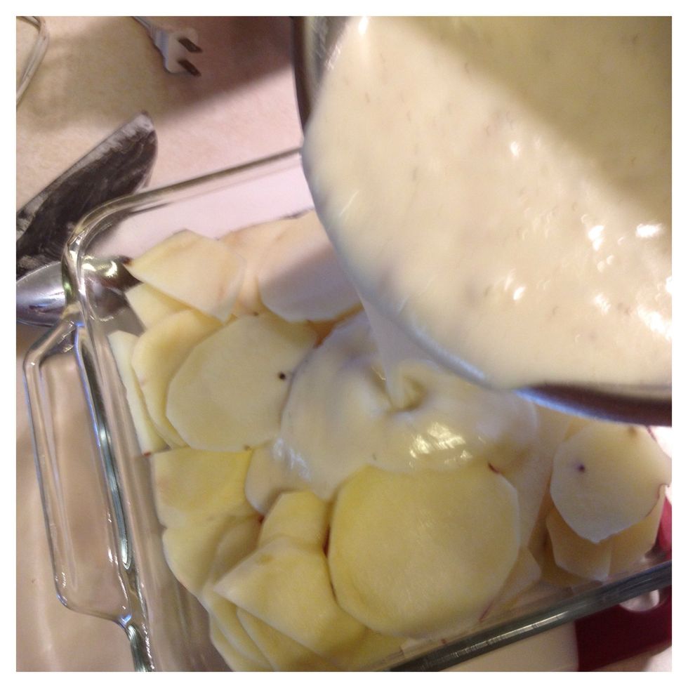 Pour carefully over the sliced potatoes.