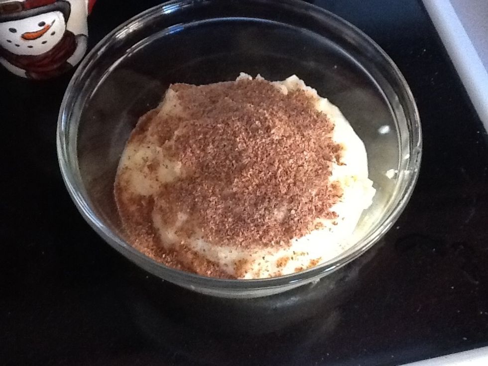 Pour cauliflower into a bowl and add 1/2 cup of milled flax seed. It helps bind the cauliflower into dough. Next heat the mixture about 1 min then add 1 bag of mozzarella cheese (any brand).