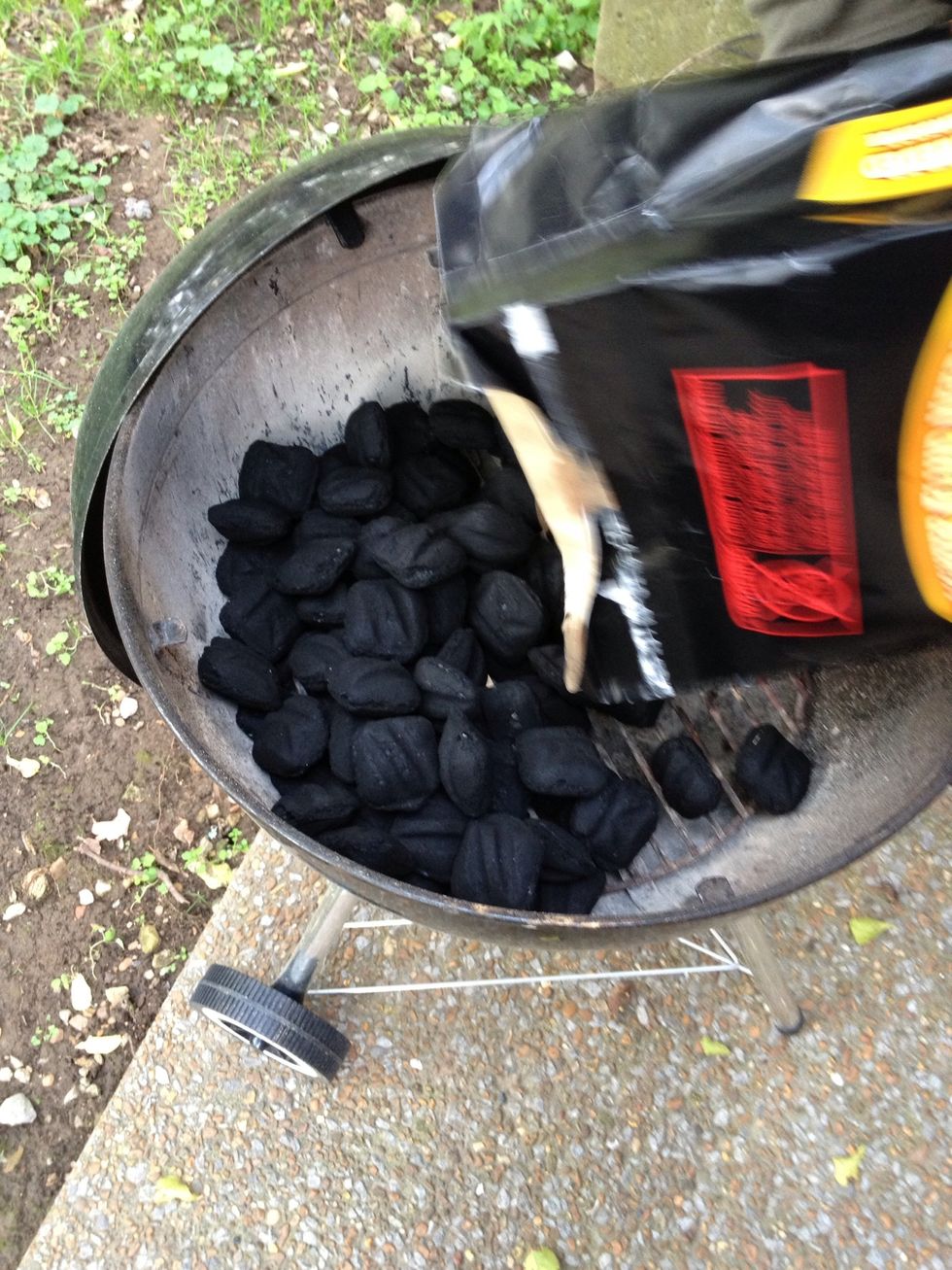 Pour charcoal on only half of the side. This grill is a small grill. You would need generally more surface space for the amount of ribs we are doing. A regular size grill would be preferable.