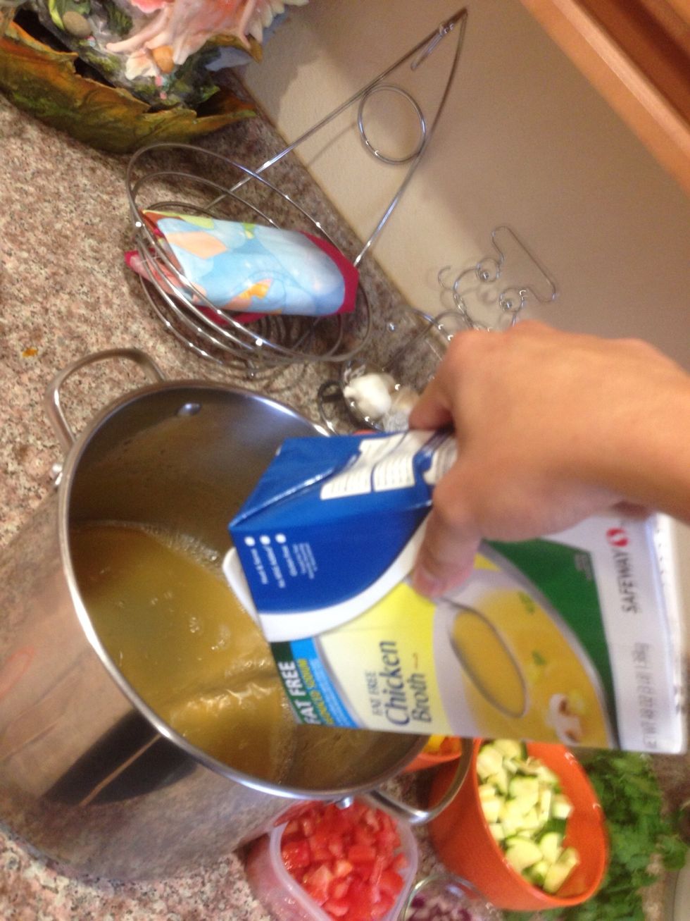 Pour chicken broth, water and bring to a boil add celery and carrots. Meanwhile brown chicken.