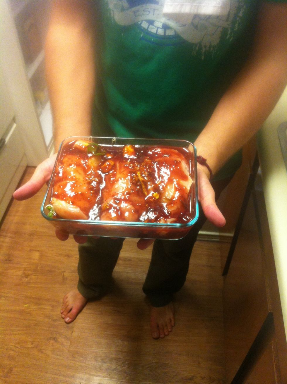 Pour chipotle raspberry sauce over chicken. Be sure to let it seep underneath and cover chicken well.  Place in oven and cook on 400 for about 45-1hr or until meat is cooked through and through.