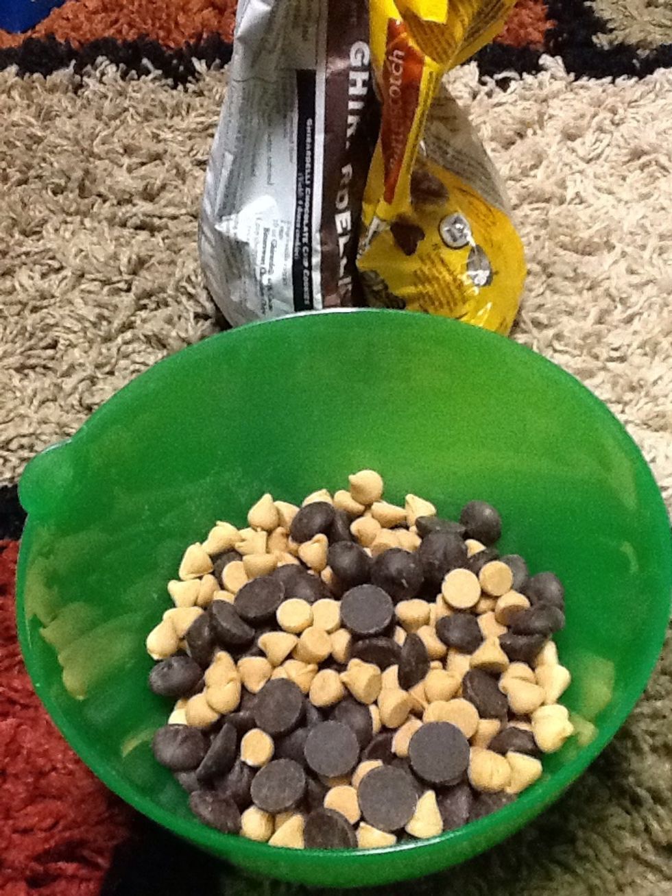 Pour chocolate and butterscotch chips in bowl and mix together