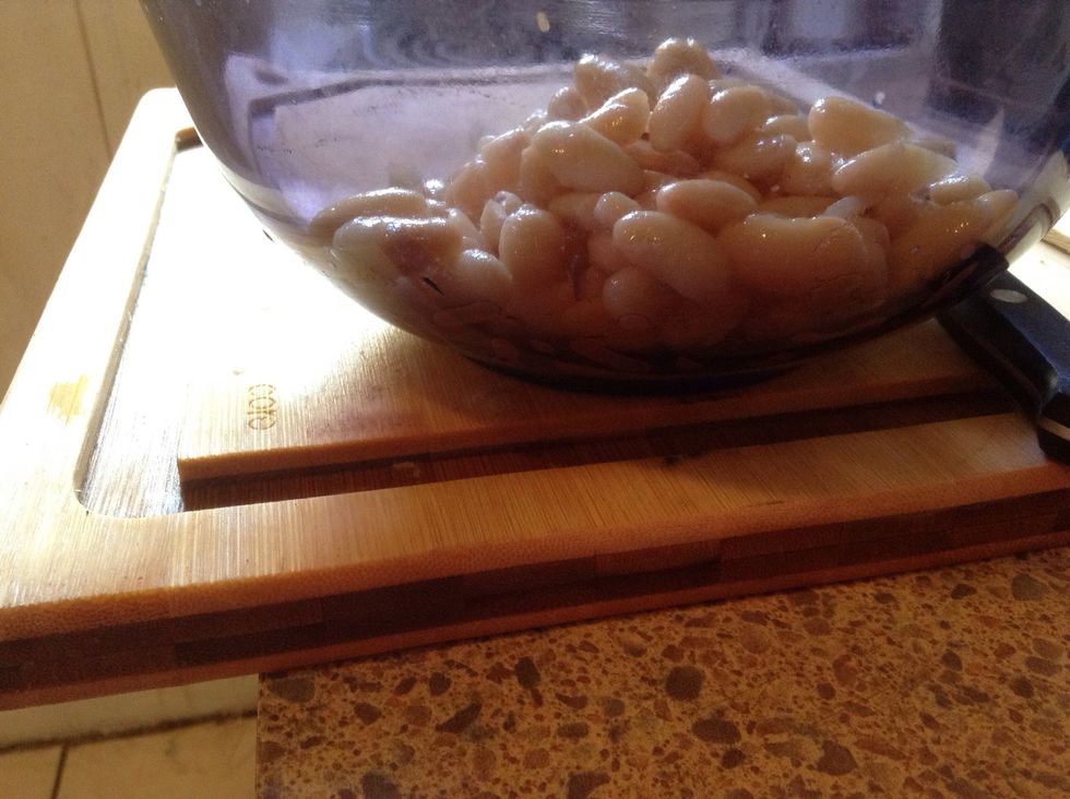 Pour clean beans on top of chopped onion