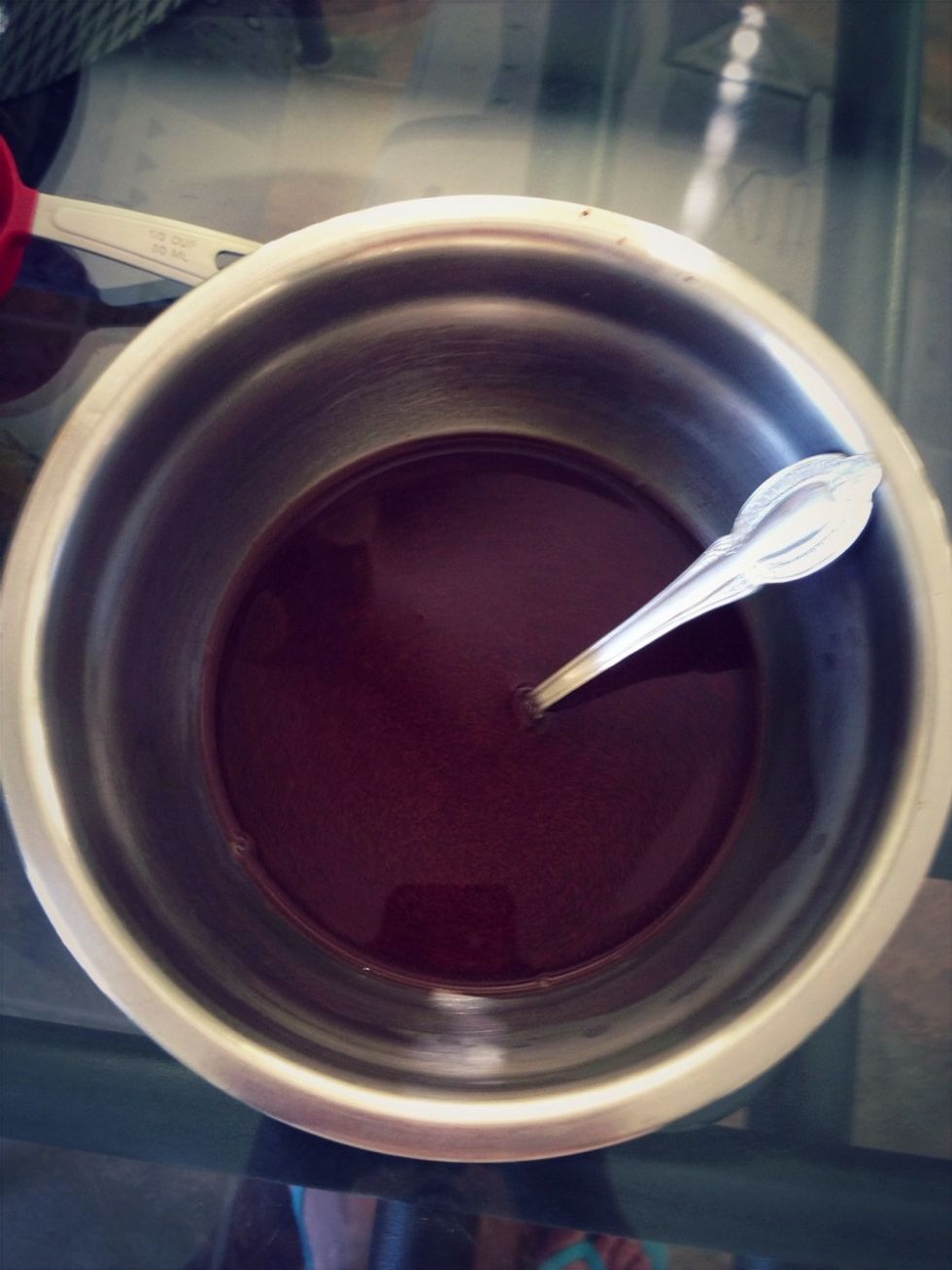 Pour coffee over the chocolate and stir, pausing intermittently to allow the chocolate to melt. Set aside.