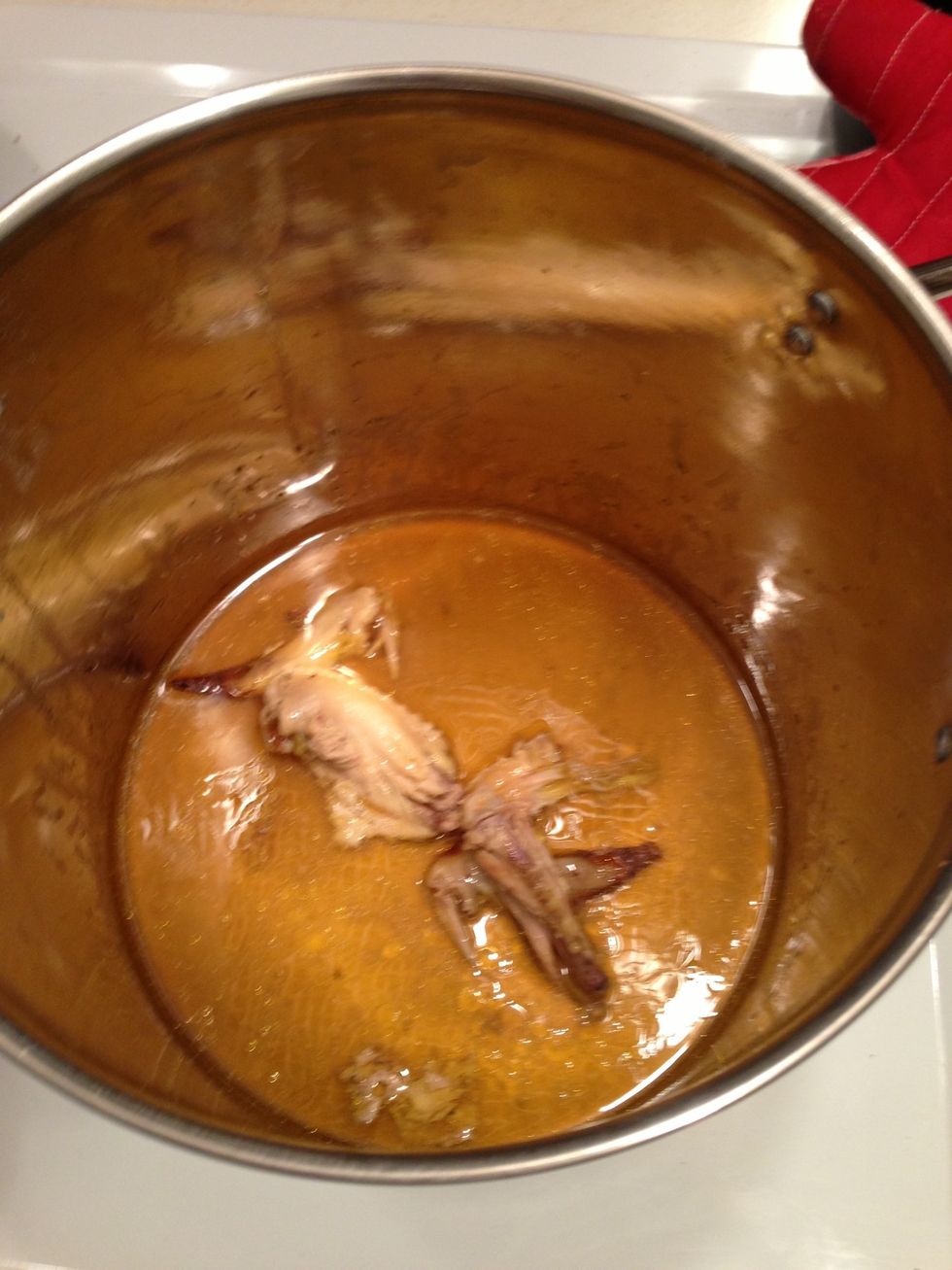 Pour cooking juices and any pieces that fell off the chicken into the pot.