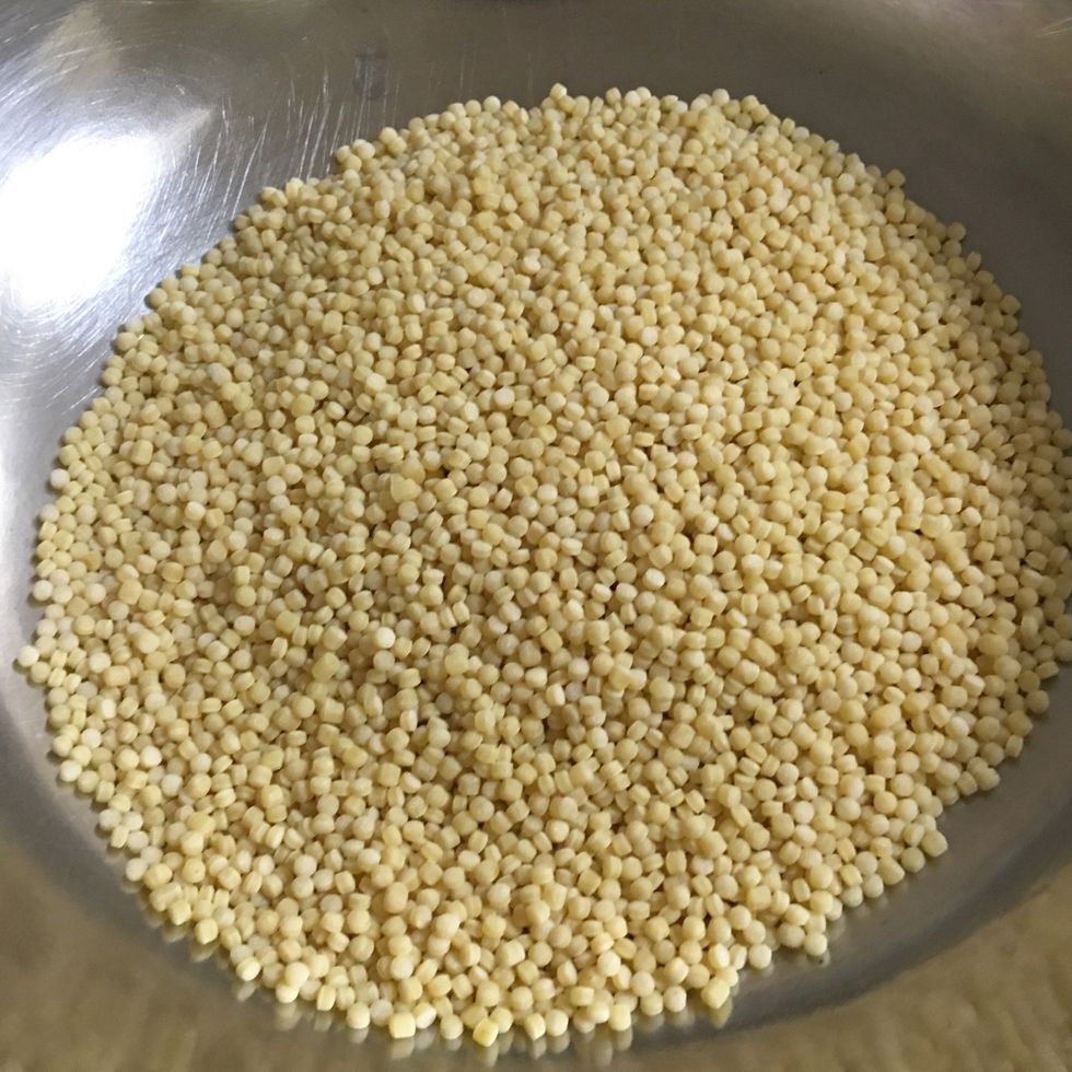 Pour couscous in a large bowl.