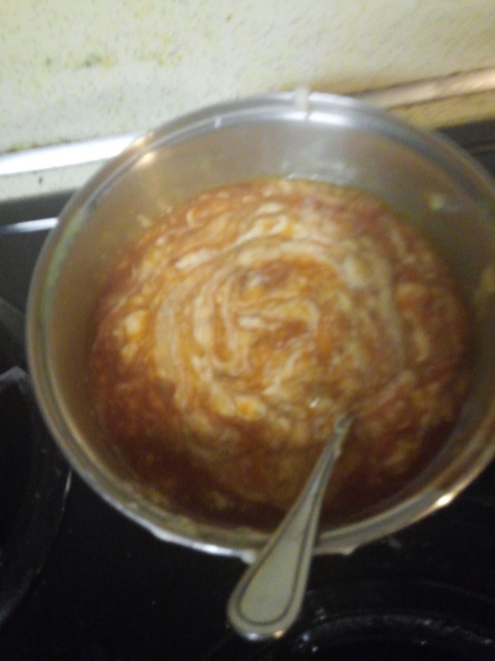 Pour cream of mushroom soup, enchilada sauce w/green chilis, and bottle of taco sauce and mix on the stove