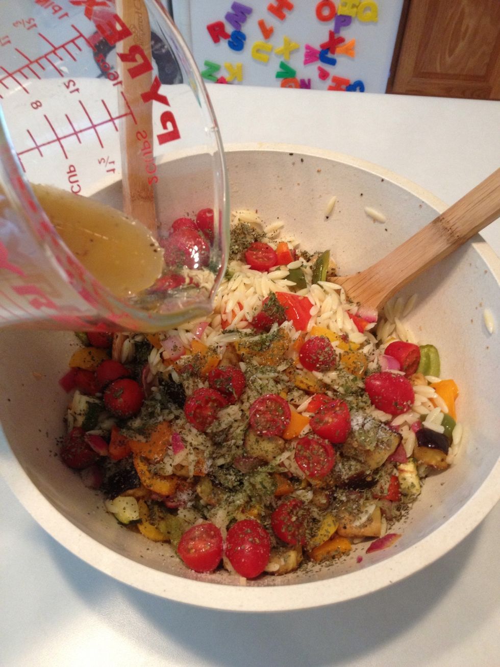 Pour dressing back in over veggies and orzo.