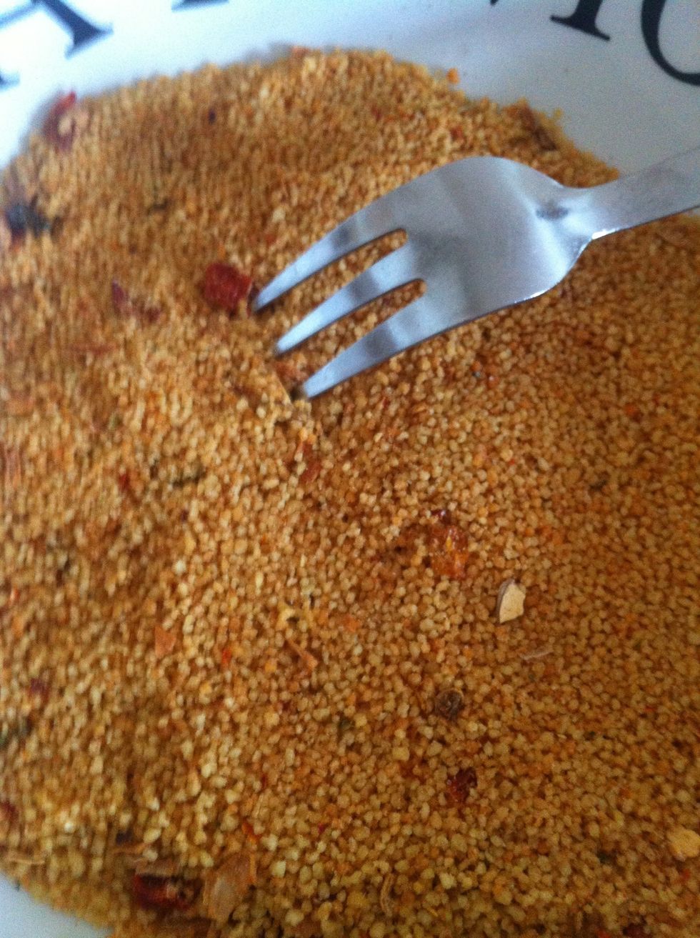 Pour dried Cous Cous into bowl