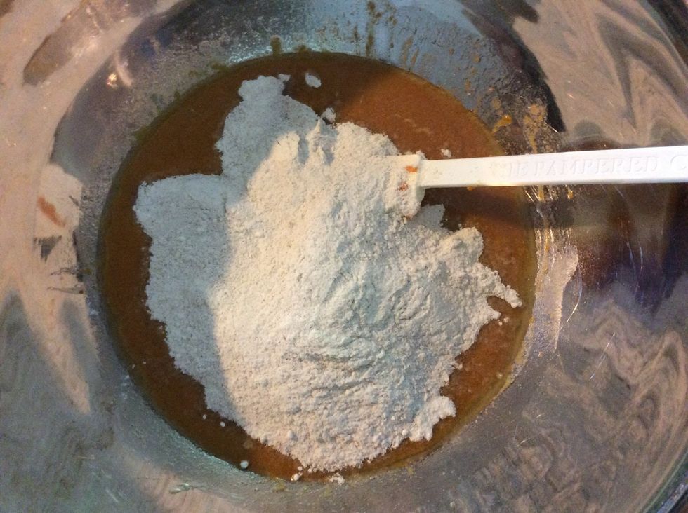 Pour dry ingredients into wet ingredients.