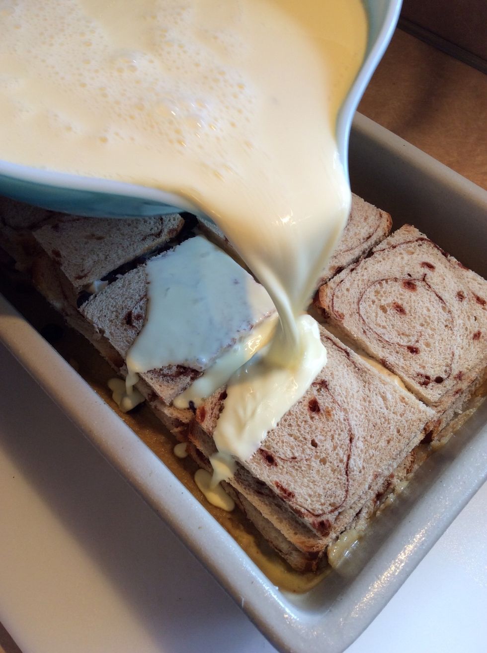 Pour egg custard over the bread ...