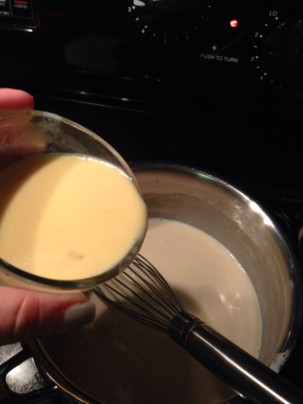 Pour egg mixture into sauce; whisking constantly.