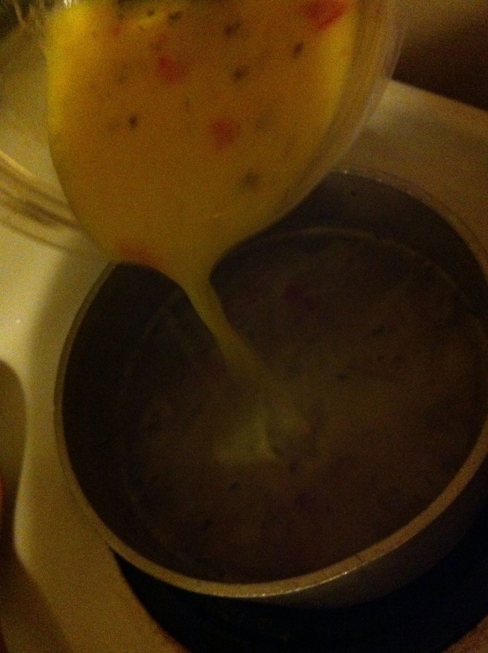 Pour egg/soup mixture into pot of soup and stir slowly.