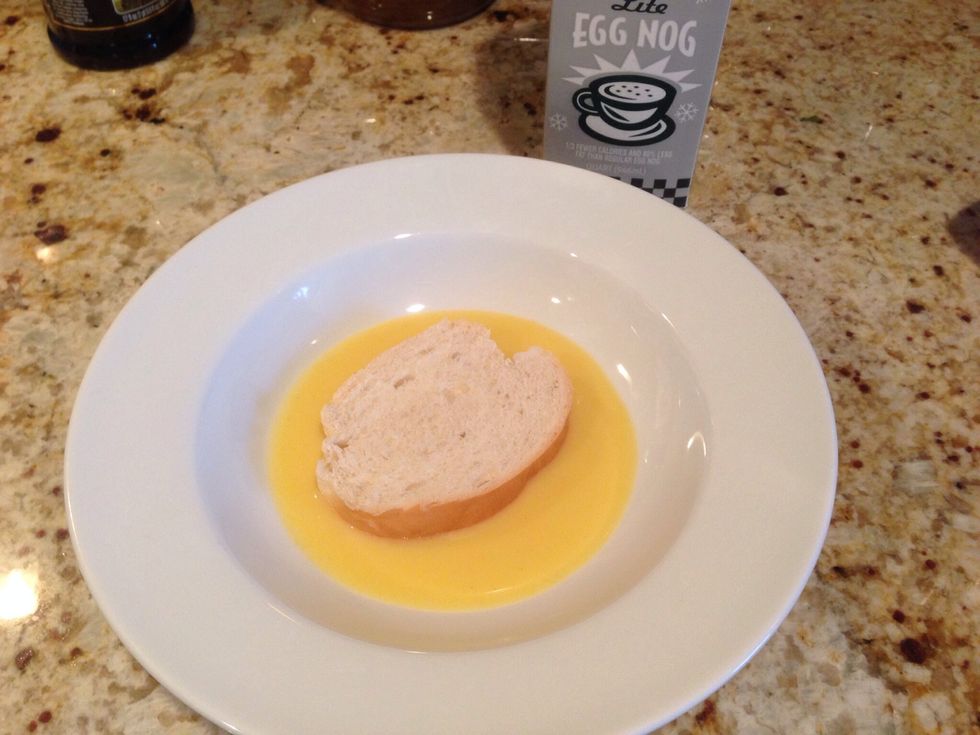 Pour eggnog in a bowl and soak your bread in it. No need to add eggs.
